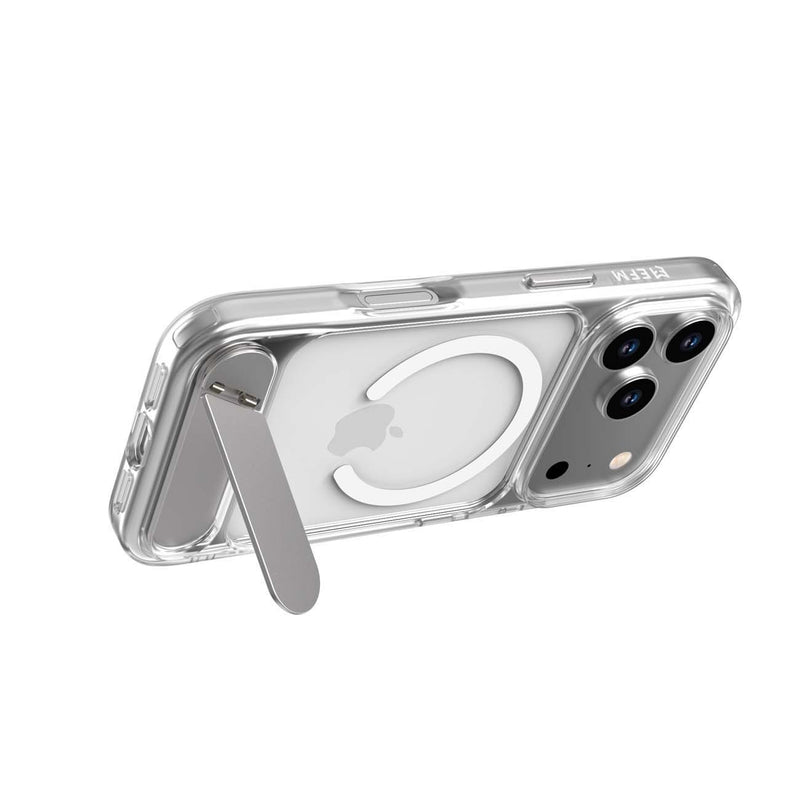 A clear protective phone case with a built-in silver metal kickstand, shown on a silver iPhone. The case features a MagSafe-compatible circular ring on the back.