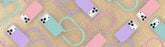 Pattern of phone cases with lanyards on a beige background